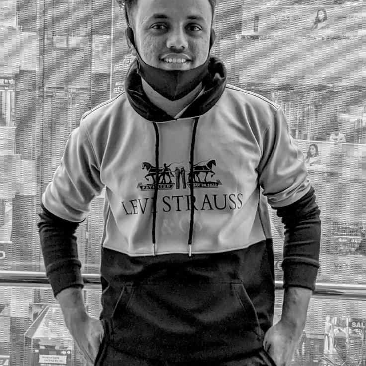 Kaveri Mehta, Lead Design Curator at LanePathStudio, reviewing corporate floral arrangements